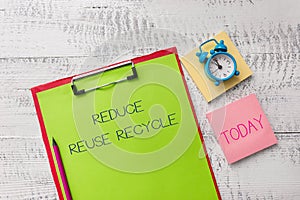 Handwriting text Reduce Reuse Recycle. Concept meaning environmentallyresponsible consumer behavior Metal clipboard