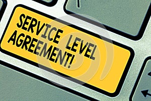 Handwriting text Service Level Agreement. Concept meaning Commitment between a service provider and a client Keyboard