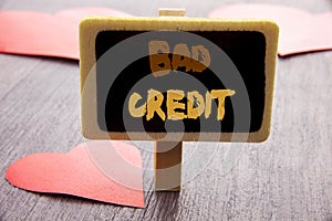 Handwriting text showing Bad Credit. Business photo showcasing Poor Bank Rating Score For Loan Finance written on blackboard on th