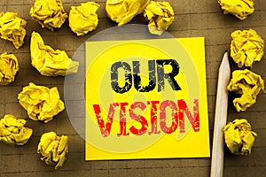 Handwriting text showing Our Vision. Business concept for Marketing Strategy Vision written on sticky note paper on the vintage ba