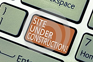 Handwriting text Site Under Construction. Concept meaning Implies something is being built for the first time Keyboard