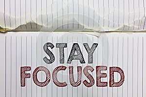 Handwriting text Stay Focused. Concept meaning Be attentive Concentrate Prioritize the task Avoid distractions Open notebook page