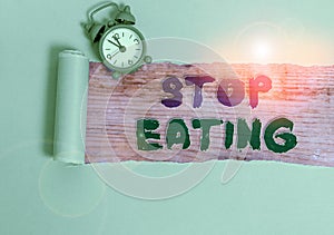 Handwriting text Stop Eating. Concept meaning cease the activity of putting or taking food into the mouth
