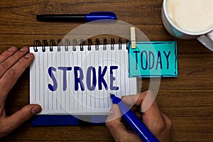Handwriting text Stroke. Concept meaning Patients losing consciousness due to poor blood flow medical Marker pens notepad cup milk