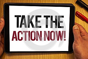 Handwriting text Take The Action Now Motivational Call. Concept meaning Act Start Promptly Immediate Instantly Hand hold showing c photo