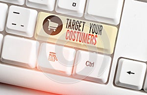 Handwriting text Target Your Costumers. Concept meaning Specific Range and Interest Potential Users and Buyers White pc