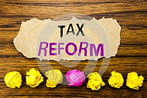 Handwriting text Tax Reform. Concept for Government Change in Taxes Written on sticky note paper reminder, wooden background wit