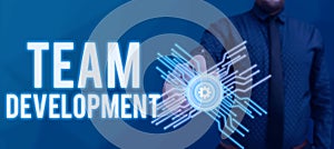 Hand writing sign Team Developmentlearn why and how small groups change over time with graphs. Business overview learn