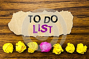 Handwriting text To Do List. Concept for Plan Lists Remider Written on sticky note paper reminder, wooden background with sticky photo