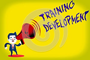 Handwriting text Training Development. Concept meaning Learn and Expand skills and knowledge Program Man in Suit Earpad Standing photo