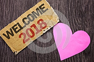 Handwriting text Welcome 2018. Concept meaning Celebration New Celebrate Future Wishes Gratifying Wish written on Cardboard Piece photo