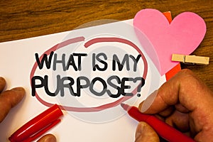 Handwriting text What Is My Purpose Question. Concept meaning Direction Importance Discernment Reflection Human hand retain red pe