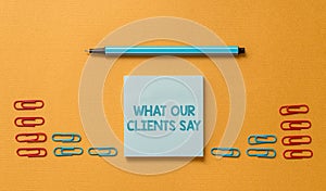 Handwriting text What Our Clients Say. Concept meaning testimonials or feedback of aclient about the product Colored photo