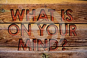 Handwriting text What Is On Your Mind Question. Concept meaning Open minded thinks of intellectual innovation Wooden background vi