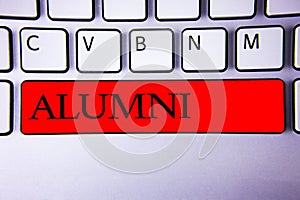 Handwriting text writing Alumni. Concept meaning Alum Old graduate Postgraduate Gathering College Academy Celebration Keyboard red