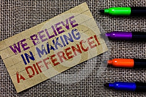 Handwriting text writing We Believe In Making A Difference. Concept meaning self-confidence that can be unique Paperboard computer