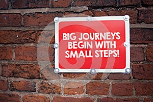 Handwriting text writing Big Journeys Begin With Small Steps. Concept meaning One step at a time to reach your goals.