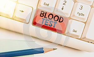 Handwriting text writing Blood Test. Concept meaning Extracted blood sample from an organism to perfom a laboratory