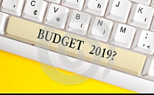 Handwriting text writing Budget 2019 Question. Concept meaning estimate of income and expenditure for next year White pc