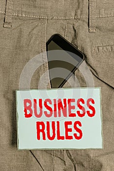 Handwriting text writing Business Rules. Concept meaning a specific directive that constrains or defines a business Smartphone