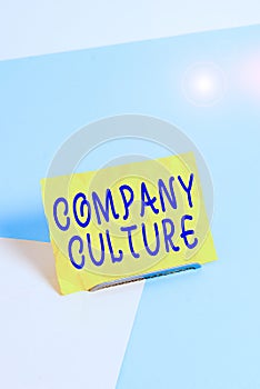 Handwriting text writing Company Culture. Concept meaning pervasive values and attitudes that characterize a company Paper placed