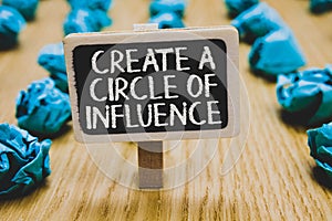 Handwriting text writing Create A Circle Of Influence. Concept meaning Be an influencer leader motivate other people Stand blackbo