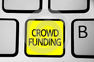 Handwriting text writing Crowd Funding. Concept meaning Fundraising Kickstarter Startup Pledge Platform Donations Keyboard yellow