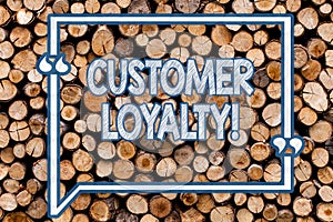 Handwriting text writing Customer Loyalty. Concept meaning Client Satisfaction LongTerm relation Confidence Wooden photo