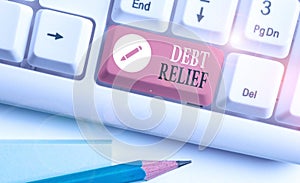 Handwriting text writing Debt Relief. Concept meaning a reduction in the amount of debt that a country has to pay photo