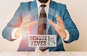 Handwriting text writing Dengue Fever. Concept meaning infectious disease caused by a flavivirus or aedes mosquitoes Man photo