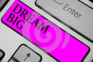 Handwriting text writing Dream Big. Concept meaning To think of something high value that you want to achieve Keyboard purple key