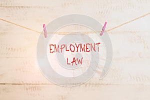 Handwriting text writing Employment Law. Concept meaning deals with legal rights and duties of employers and employees Clothesline