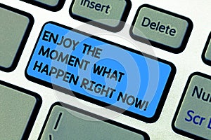 Handwriting text writing Enjoy The Moment What Happen Right Now. Concept meaning Seize the day Relax Leisure Keyboard