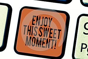 Handwriting text writing Enjoy This Sweet Moment. Concept meaning encouraging someone to love his life timeline Keyboard