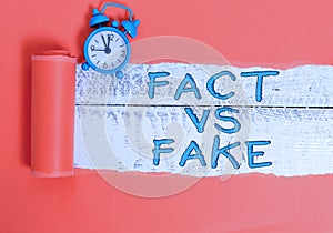 Handwriting text writing Fact Vs Fake. Concept meaning Rivalry or products or information originaly made or imitation photo