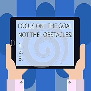 Handwriting text writing Focus On The Goal Not The Obstacles. Concept meaning Be determined to accomplish objectives Hu