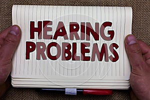 Handwriting text writing Hearing Problems. Concept meaning is partial or total inability to listen to sounds normally Man hands ho