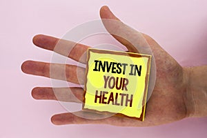 Handwriting text writing Invest In Your Health. Concept meaning Spend money in personal healthcare Preventive Tests written on Sti