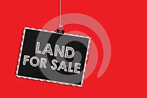 Handwriting text writing Land For Sale. Concept meaning Real Estate Lot Selling Developers Realtors Investment Hanging