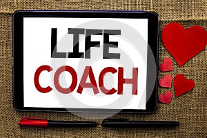 Handwriting text writing Life Coach. Concept meaning Mentoring Guiding Career Guidance Encourage Trainer Mentor written on Tablet