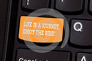 Handwriting text writing Life Is A Journey Enjoy The Ride. Concept meaning Enjoying things that happen everyday Keyboard