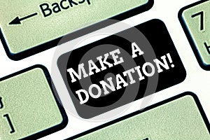 Handwriting text writing Make A Donation. Concept meaning Donate giving things not used any more to needed showing Keyboard key