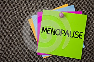 Handwriting text writing Menopause. Concept meaning Cessation of menstruation Older women hormonal changes period Sticky cards boa