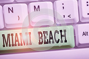 Handwriting text writing Miami Beach. Concept meaning the coastal resort city in MiamiDade County of Florida White pc photo