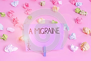 Handwriting text writing A Migraine. Concept meaning recurrent throbbing headache that affects one side of the head Colored