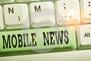 Handwriting text writing Mobile News. Concept meaning the delivery and creation of news using mobile devices White pc