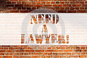 Handwriting text writing Need A Lawyer. Concept meaning Offering of legal advice Attorney consultancy advice Brick Wall