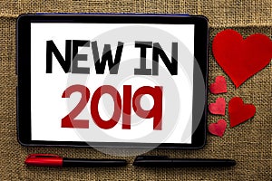 Handwriting text writing New In 2019. Concept meaning Fresh Era Latest Year Period Season Annual Coming Modern written on Tablet o