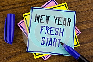Handwriting text writing New Year Fresh Start. Concept meaning Time to follow resolutions reach out dream job written on Sticky no