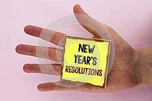 Handwriting text writing New Year'S Resolutions. Concept meaning Goals Objectives Targets Decisions for next 365 days written on